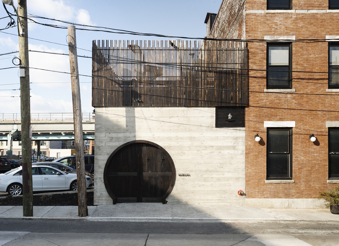 The understated wood-and-concrete façade of the Hiroki Omakase Philadelphia restaurant at 1355 N. Front Street in Fishtown.