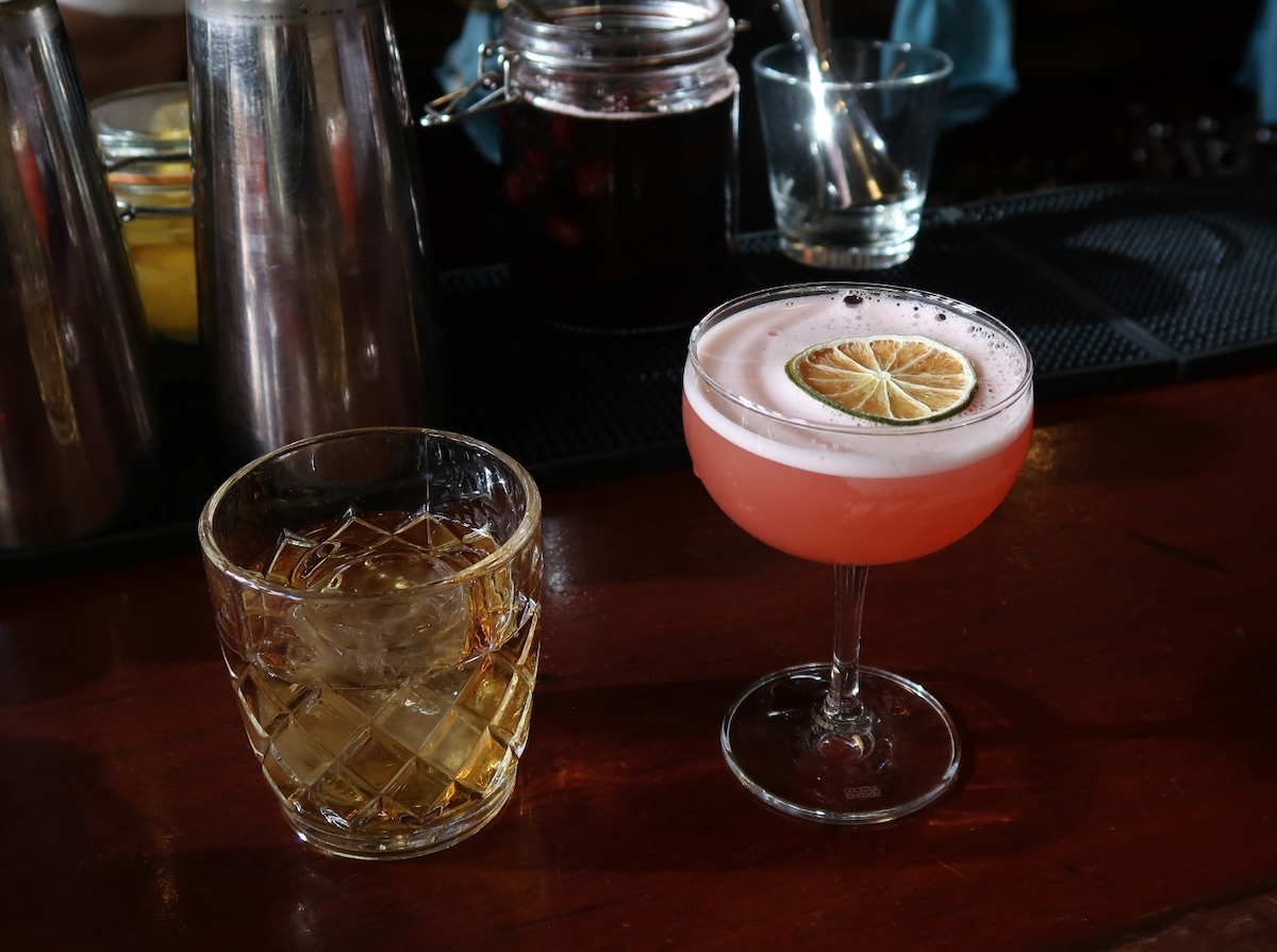 The Sassafras Chartreuse menu spans the $115 Àrd-Rìgh and the $17 Naked & Famous, demonstrating the program’s editorial range.