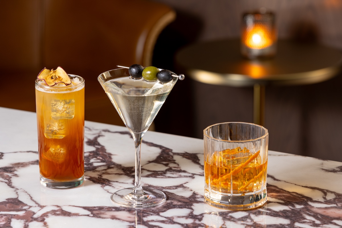 Bar program lineup with highball, martini, and Old Fashioned at Merrick's Tavern