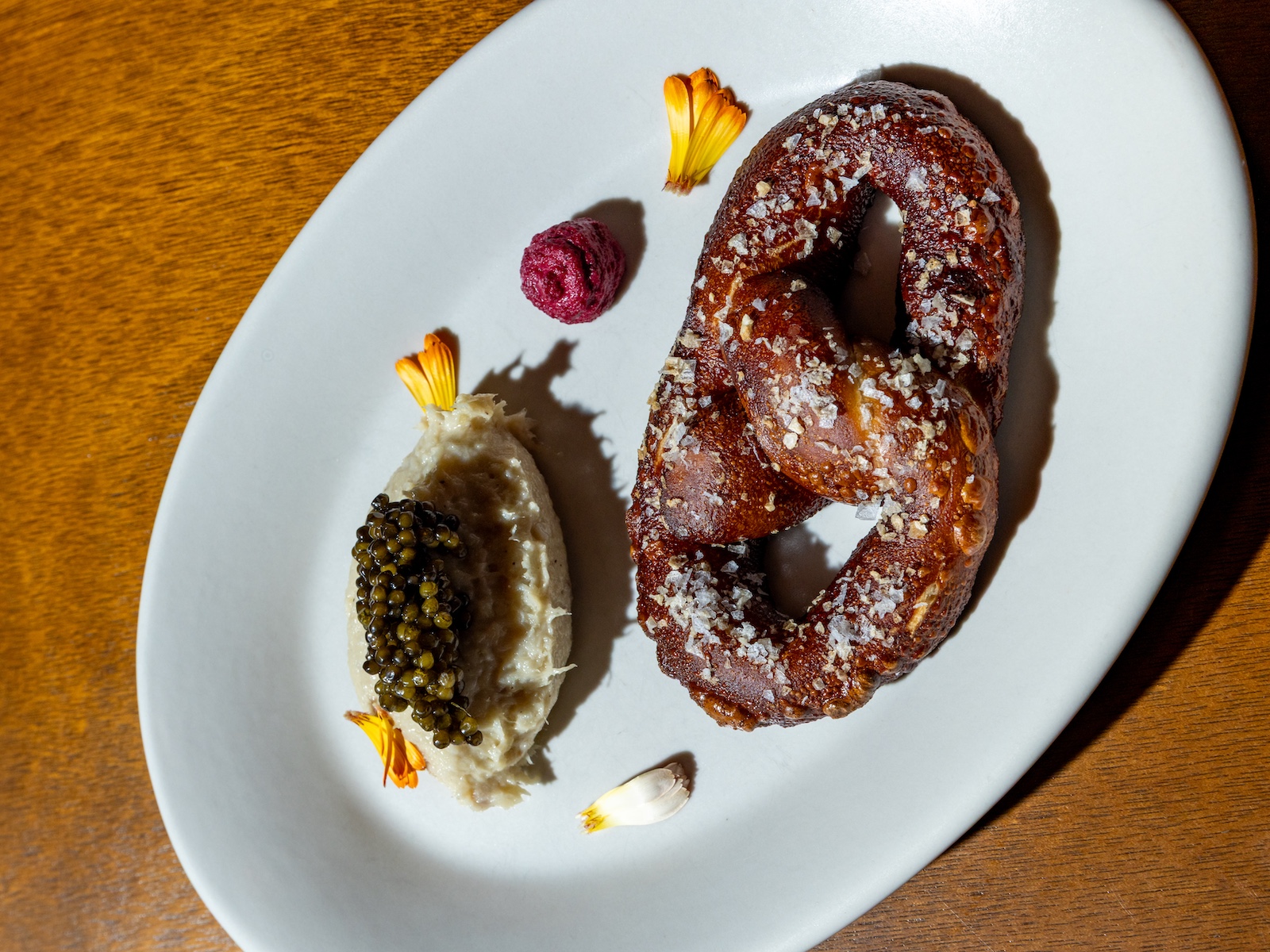 Post Haste Philadelphia Steps Into Its Next Chapter with Chef Ari Miller and a Reimagined Dining Room 3 Pretzel with whitefish and caviar at Post Haste Philadelphia
