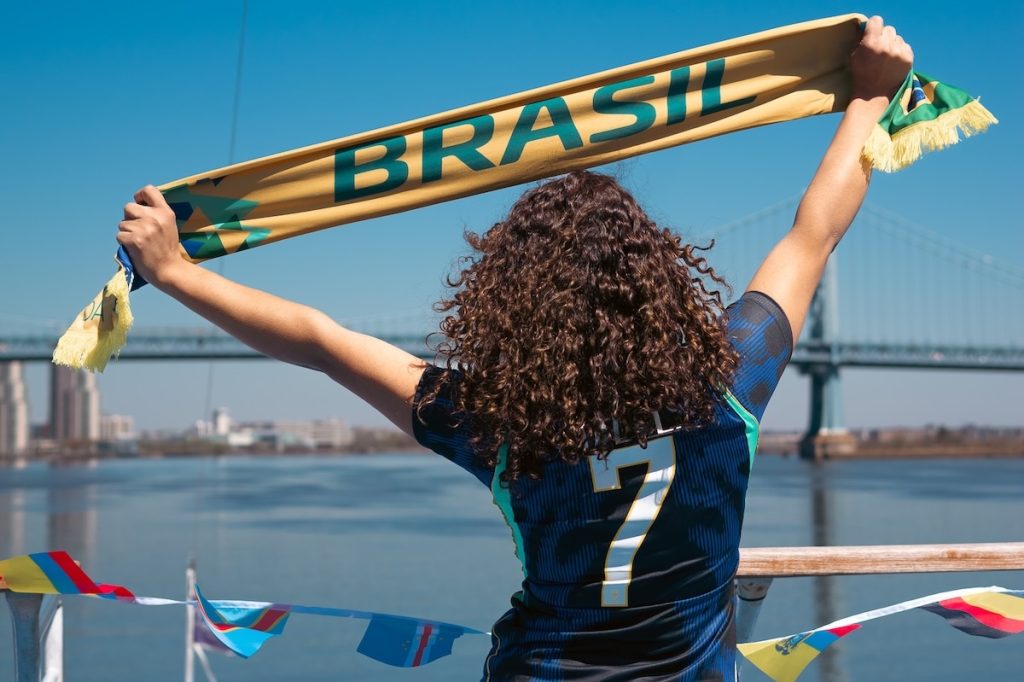 Fans celebrating at the Philly World Cup Cruise on the Delaware River